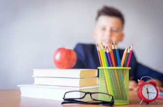 boy looking on a tidied desk